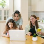 Family of three engaged in online activities at home with a diverse setting and warm ambiance.